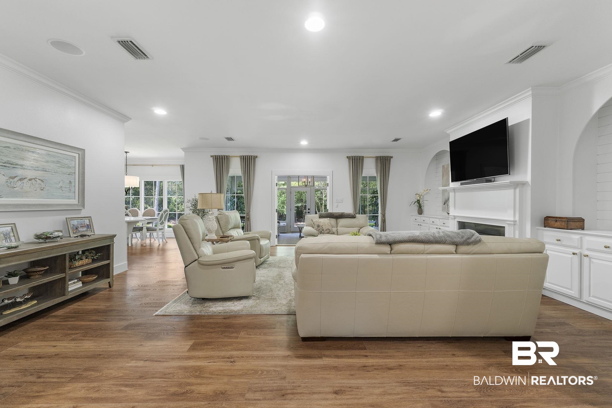 4451 Millhouse Road Gulf Shores, AL 36542 - Photo 7 of 50 Living room featuring ornamental molding and hardwood / wood-style floors