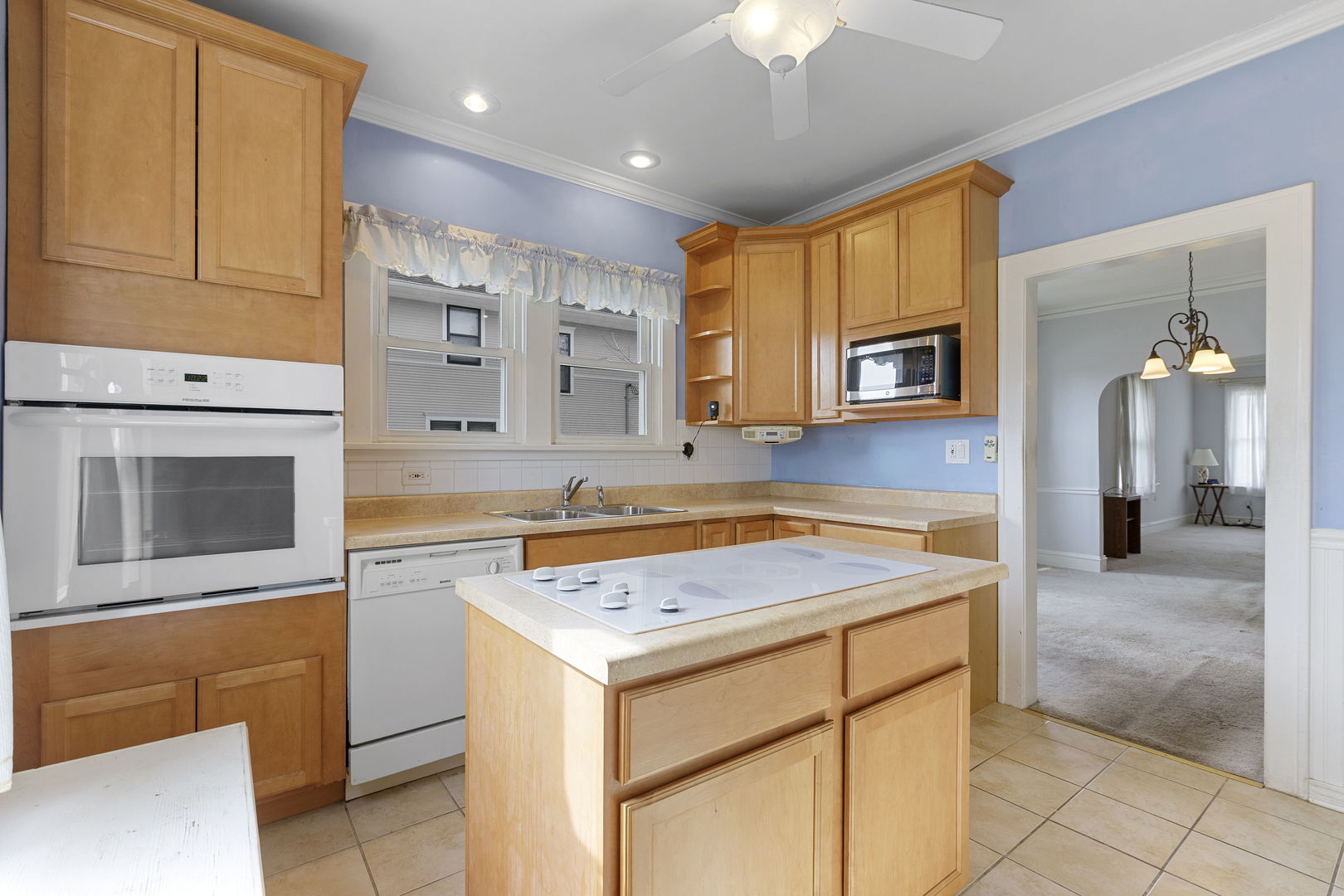 825 St John Street Elgin, IL 60120 - Photo 17 of 28 a kitchen with a stove microwave and sink