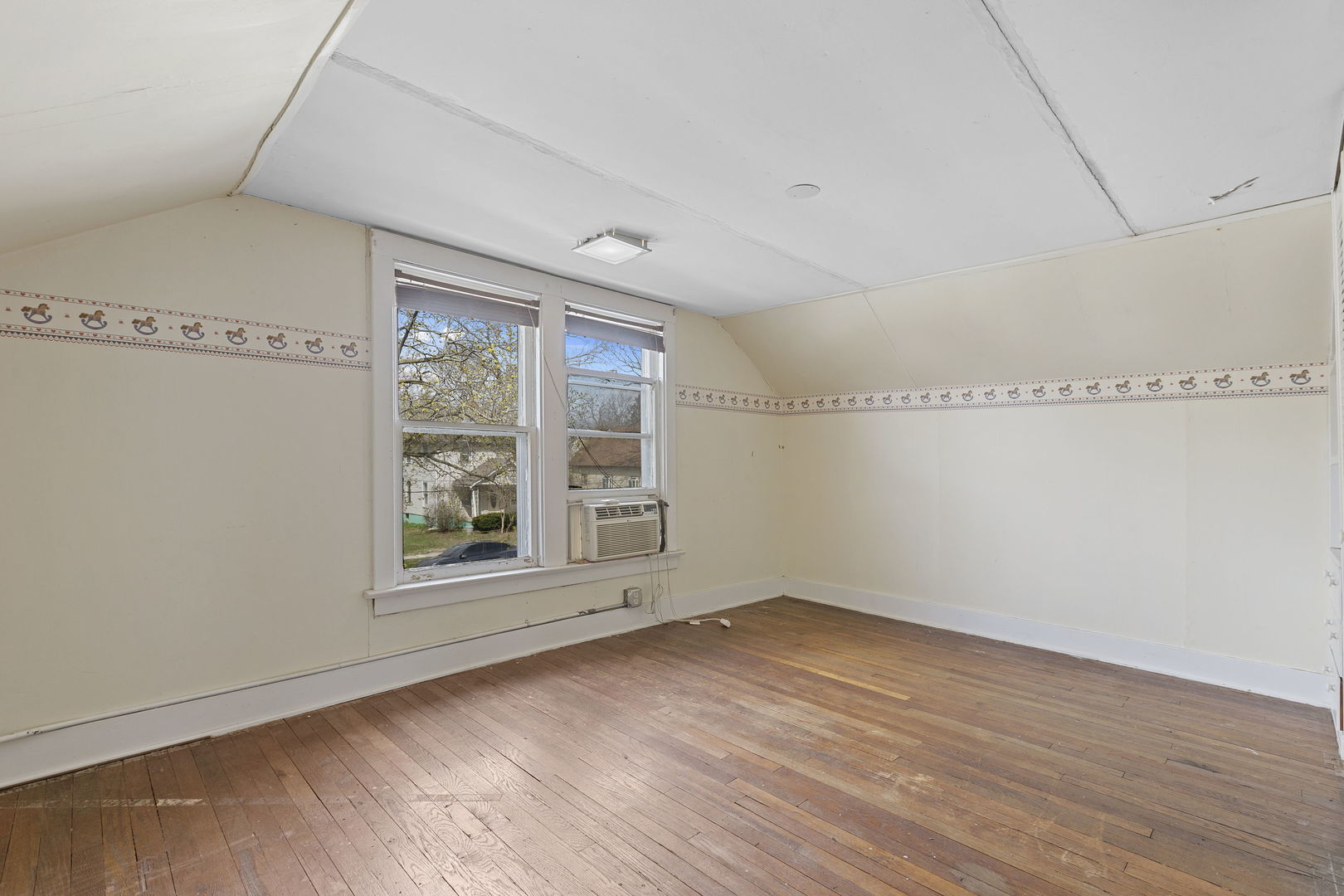 825 St John Street Elgin, IL 60120 - Photo 18 of 28 a view of empty room with wooden floor and fan