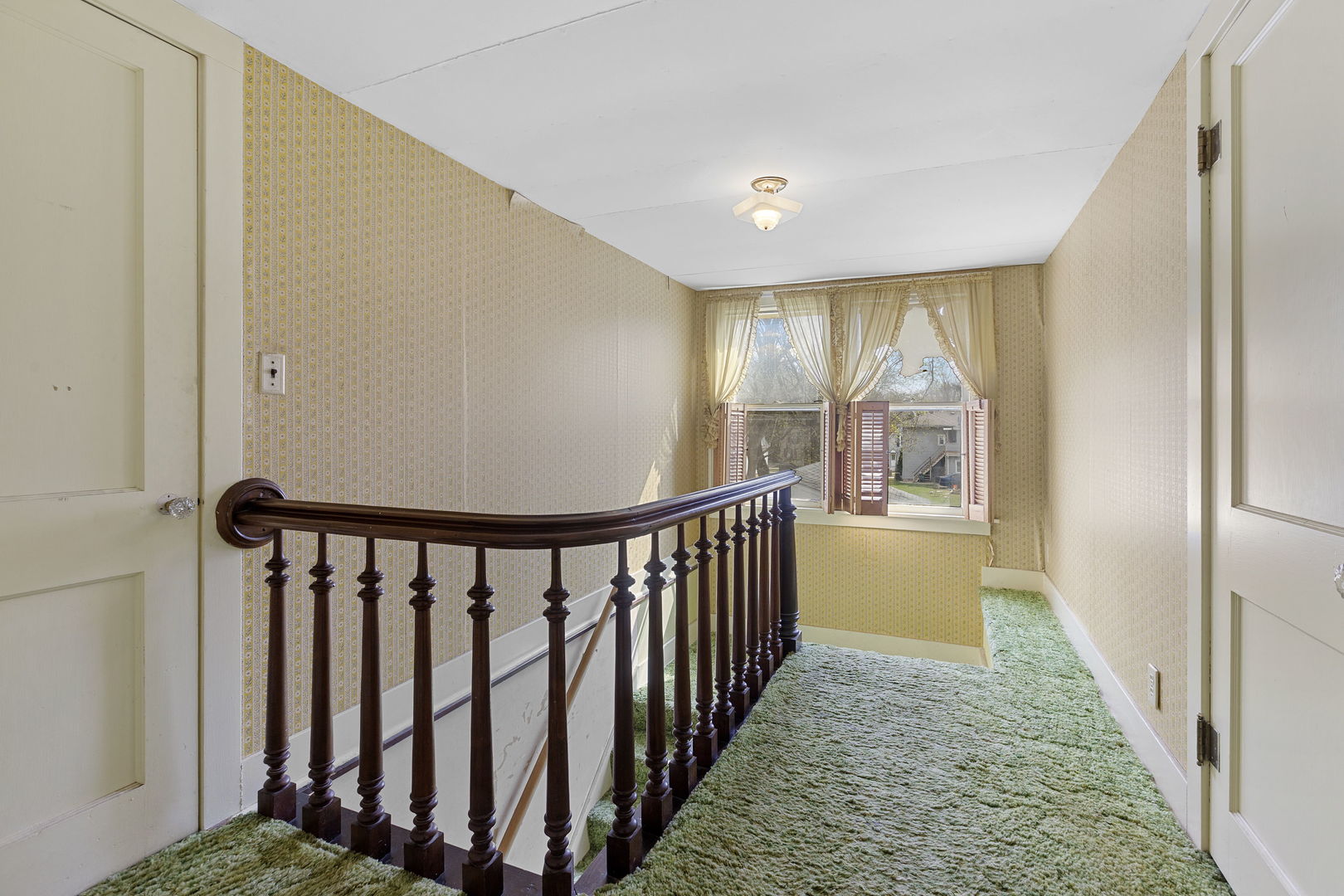 825 St John Street Elgin, IL 60120 - Photo 21 of 28 a view of hallway with wooden floor and fence