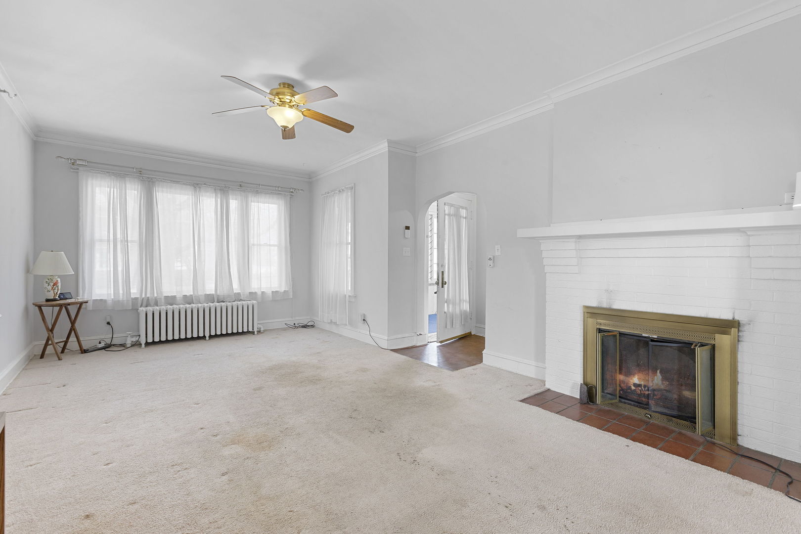 825 St John Street Elgin, IL 60120 - Photo 3 of 28 an empty room with windows and fireplace