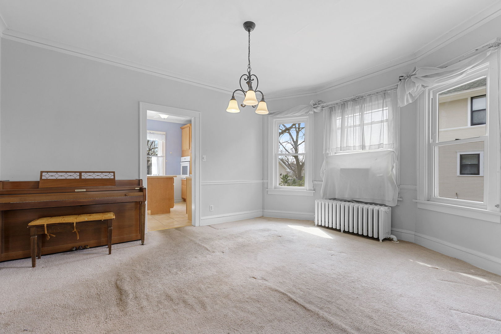 825 St John Street Elgin, IL 60120 - Photo 8 of 28 an empty room with windows and ceiling fan