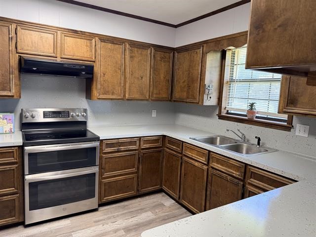 8957 Tejas Lane Silsbee, TX 77656 - Photo 13 of 50 a kitchen with a sink stove and microwave