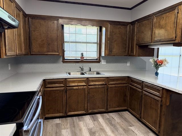 8957 Tejas Lane Silsbee, TX 77656 - Photo 14 of 50 a kitchen with stainless steel appliances granite countertop a sink stove and cabinets