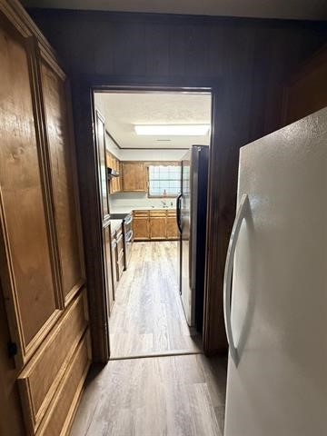 8957 Tejas Lane Silsbee, TX 77656 - Photo 15 of 50 a view of a hallway with wooden floor and door