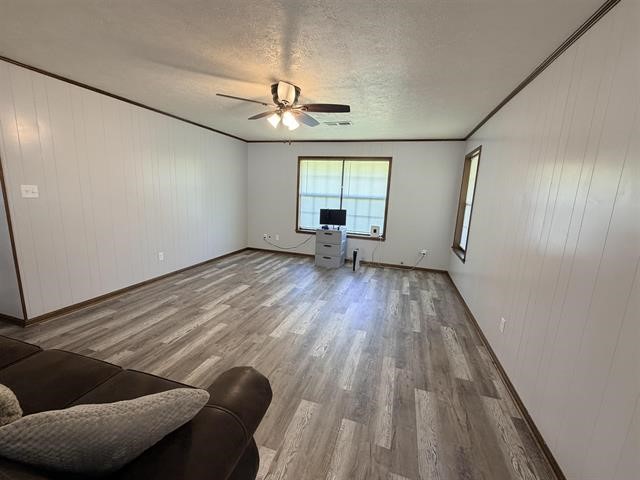 8957 Tejas Lane Silsbee, TX 77656 - Photo 22 of 50 wooden floor in an empty room with a window