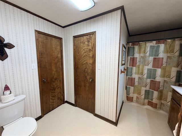 8957 Tejas Lane Silsbee, TX 77656 - Photo 31 of 50 a bathroom with a toilet and a shower