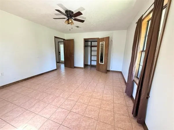 a view of a hallway with a chandelier