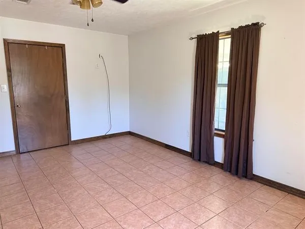 an empty room with closet area