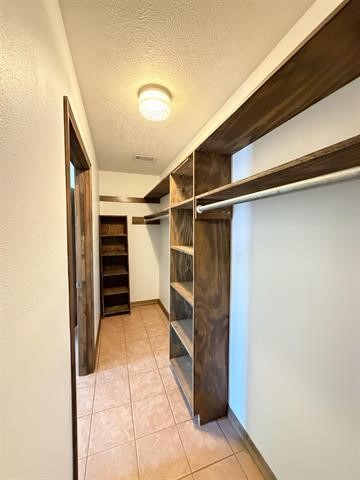 8957 Tejas Lane Silsbee, TX 77656 - Photo 35 of 50 a view of walk in closet with clothes