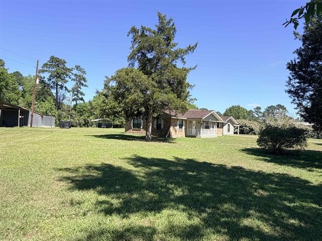 8957 Tejas Lane Silsbee, TX 77656 - Photo 4 of 50 a view of a house with a big yard