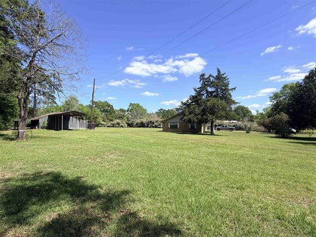 8957 Tejas Lane Silsbee, TX 77656 - Photo 44 of 50 a front view of a house with a yard