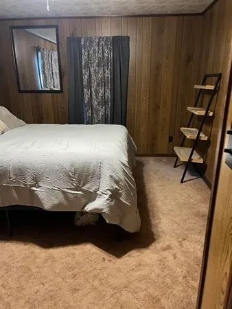 a view of bedroom with furniture