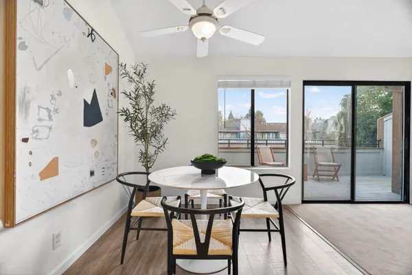 a dining room with furniture and window