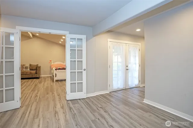 a view of a living room and wooden floor