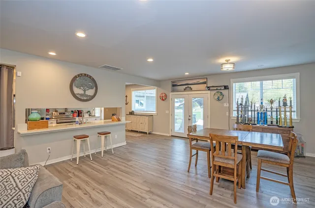 a view of a dining room with furniture window and wooden floor