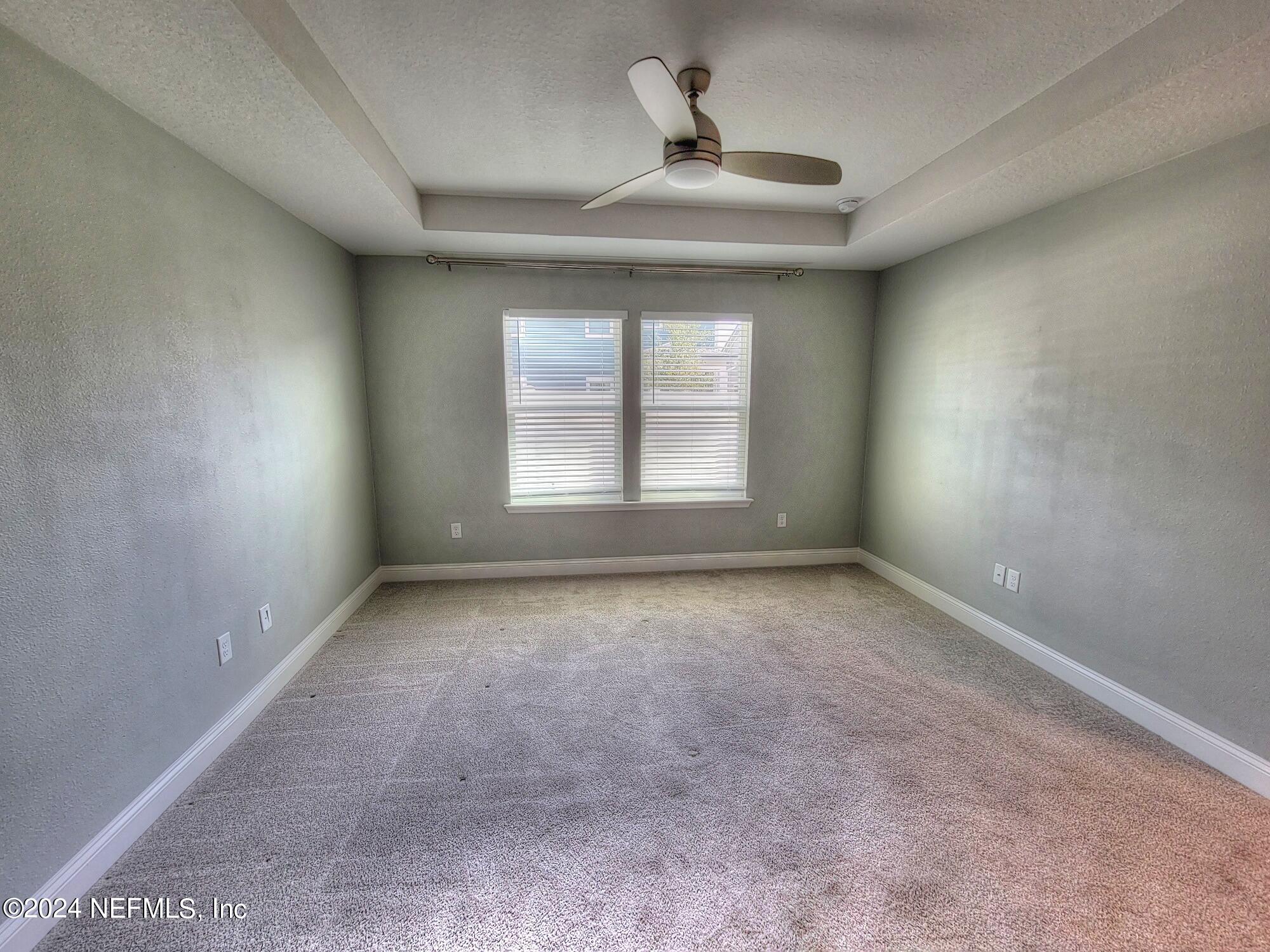 45 Vicksburg Drive St. Johns, FL 32259 - Photo 11 of 39 an empty room with a empty space and windows
