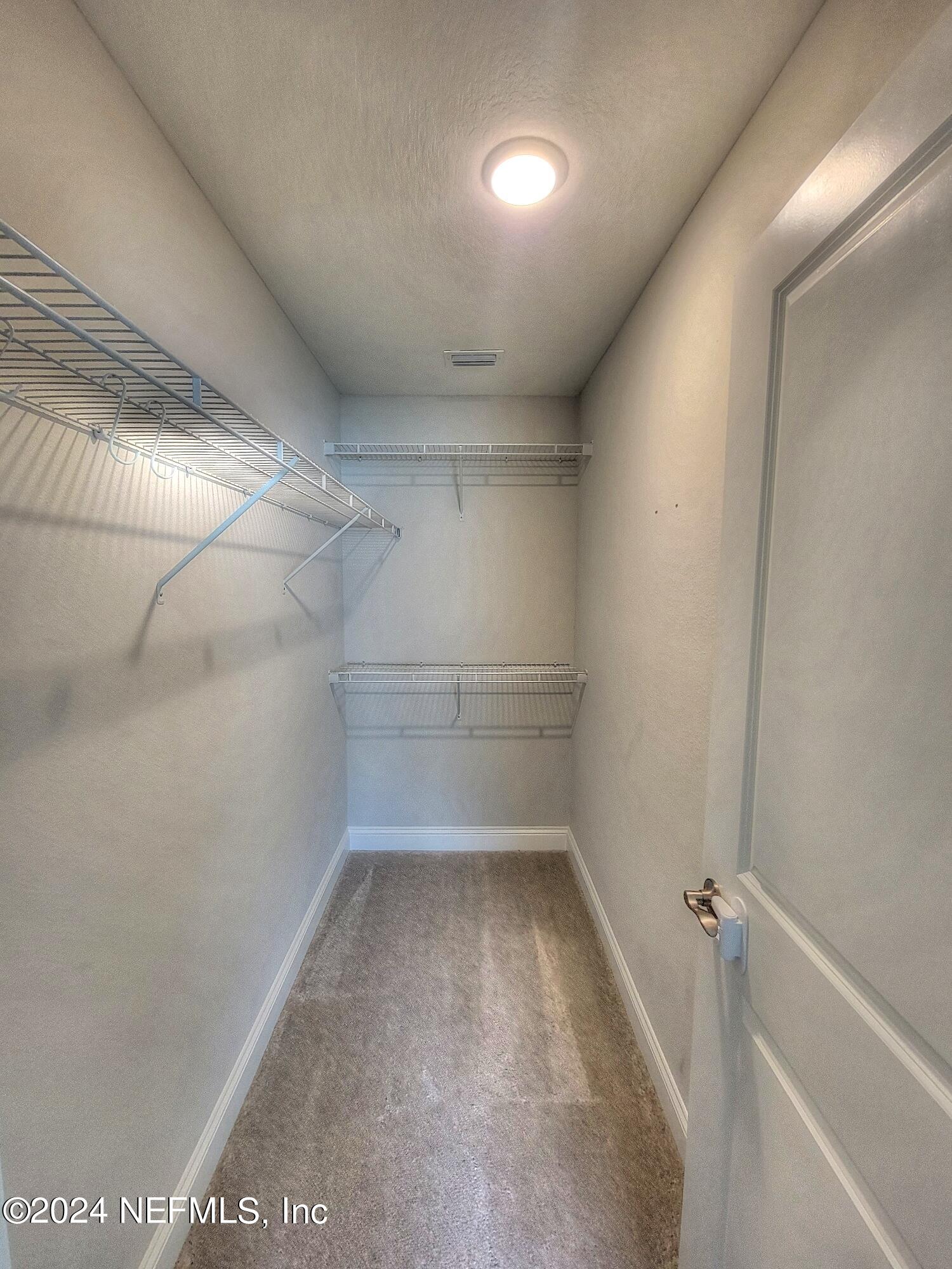 45 Vicksburg Drive St. Johns, FL 32259 - Photo 12 of 39 a view of a room with racks on the wall