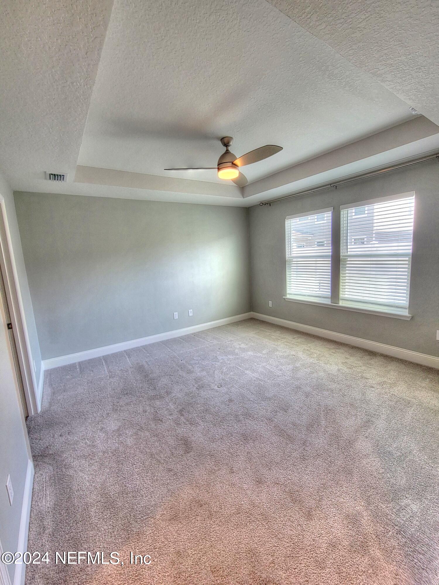 45 Vicksburg Drive St. Johns, FL 32259 - Photo 14 of 39 an empty room with windows and ceiling fan