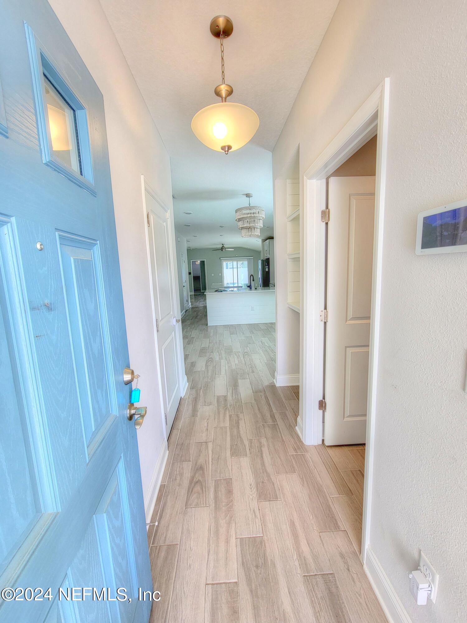 45 Vicksburg Drive St. Johns, FL 32259 - Photo 2 of 39 a view of a room with wooden floor and staircase