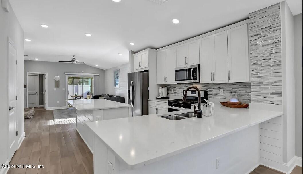45 Vicksburg Drive St. Johns, FL 32259 - Photo 21 of 39 a kitchen with sink a refrigerator and cabinets