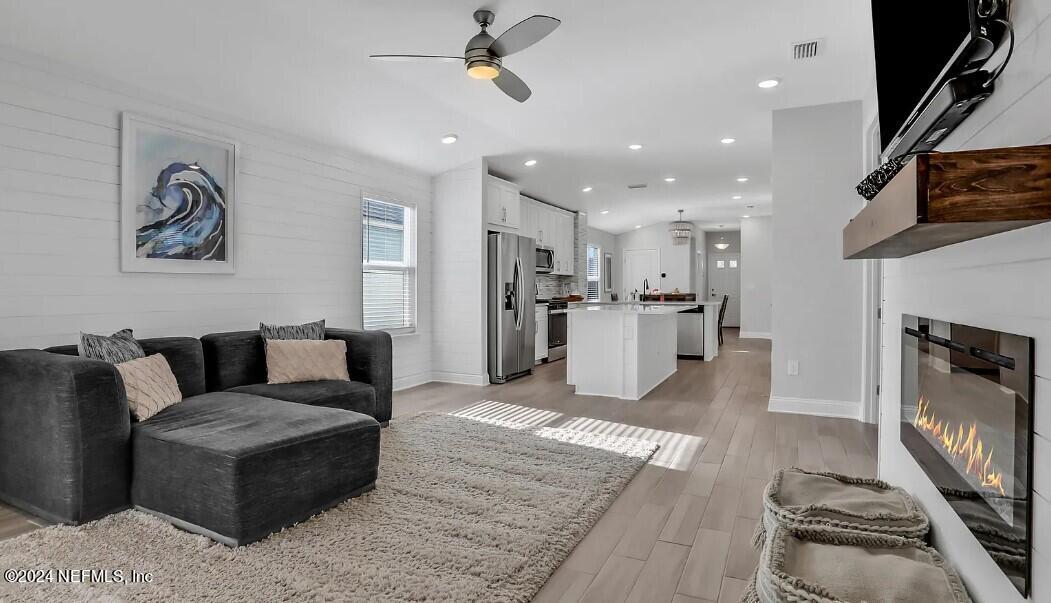45 Vicksburg Drive St. Johns, FL 32259 - Photo 28 of 39 a living room with furniture and a fireplace