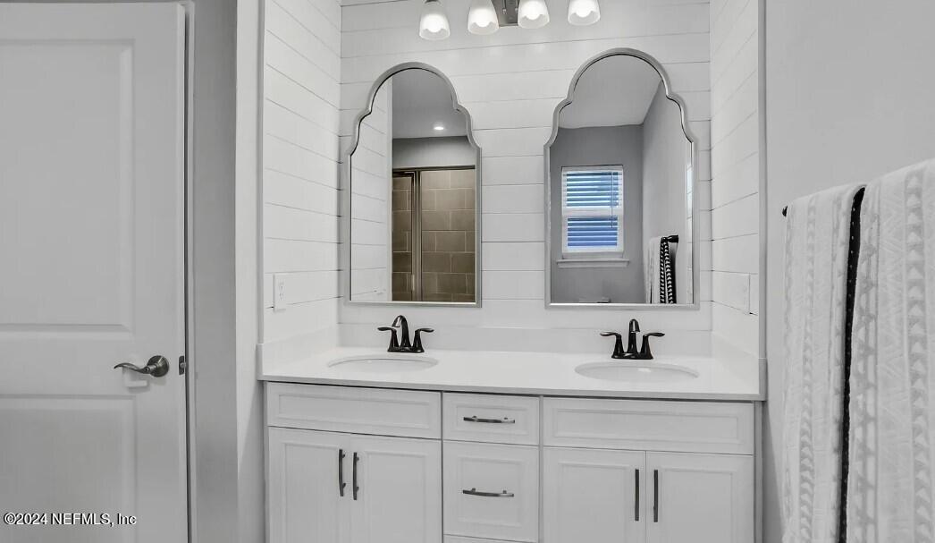 45 Vicksburg Drive St. Johns, FL 32259 - Photo 30 of 39 a bathroom with double vanity sinks and a shower