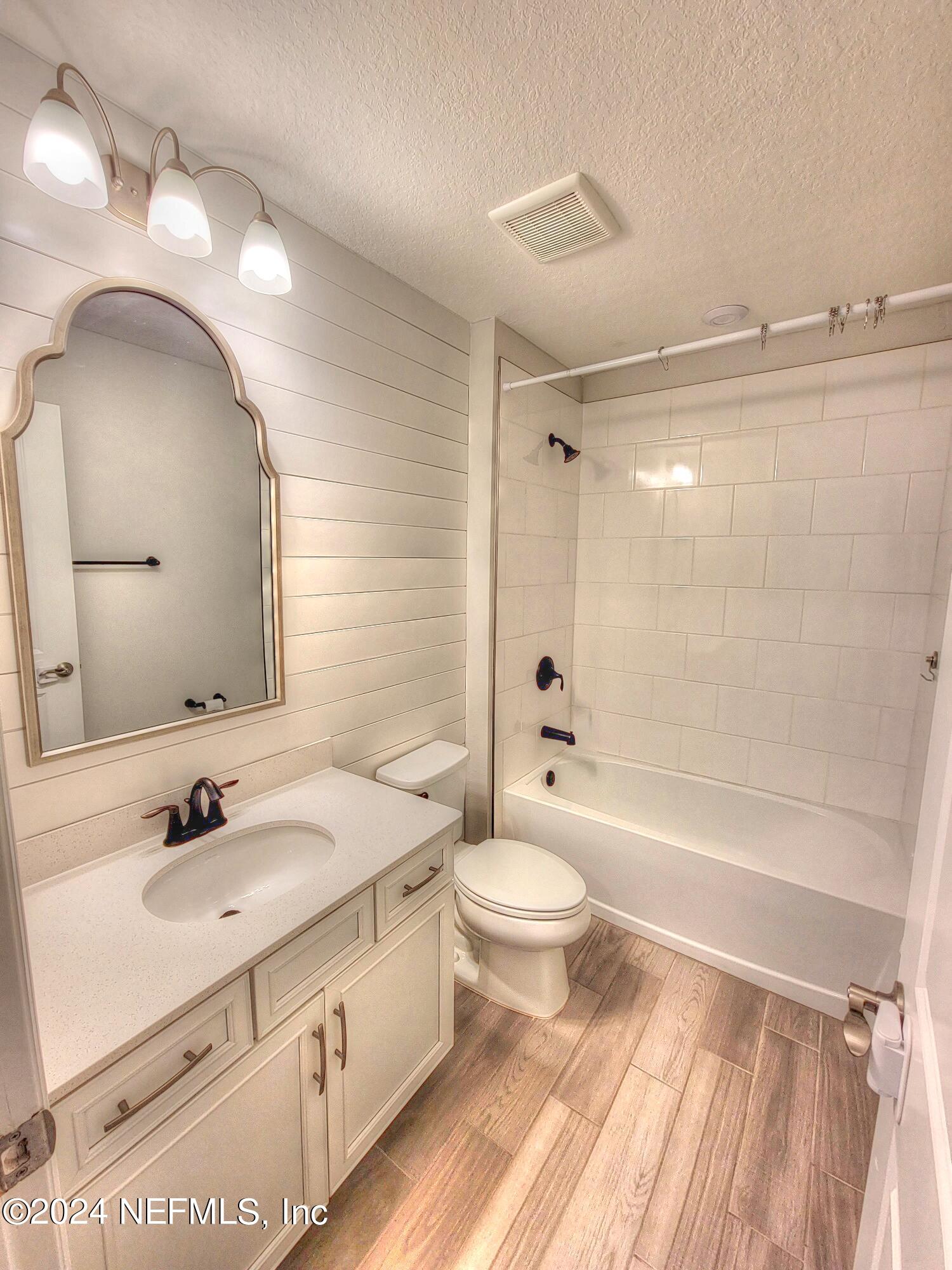 45 Vicksburg Drive St. Johns, FL 32259 - Photo 3 of 39 a bathroom with a sink a toilet a mirror and shower