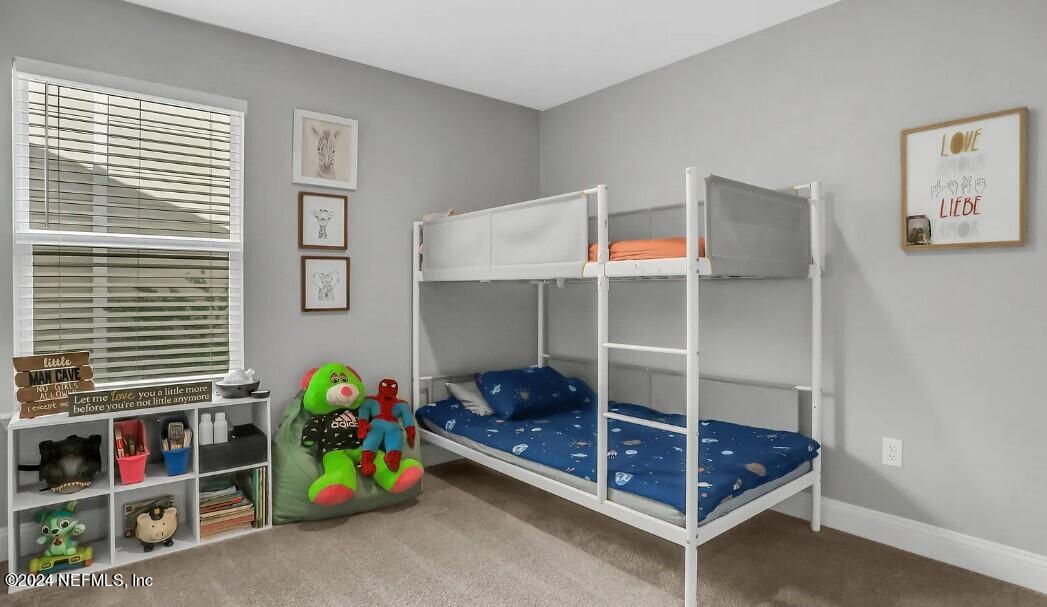45 Vicksburg Drive St. Johns, FL 32259 - Photo 32 of 39 a bedroom with bunk bed and a window