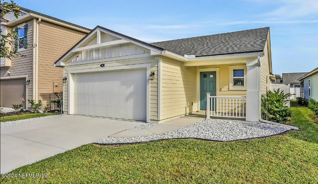 45 Vicksburg Drive St. Johns, FL 32259 - Photo 36 of 39 a view of a house with a small yard and potted plants
