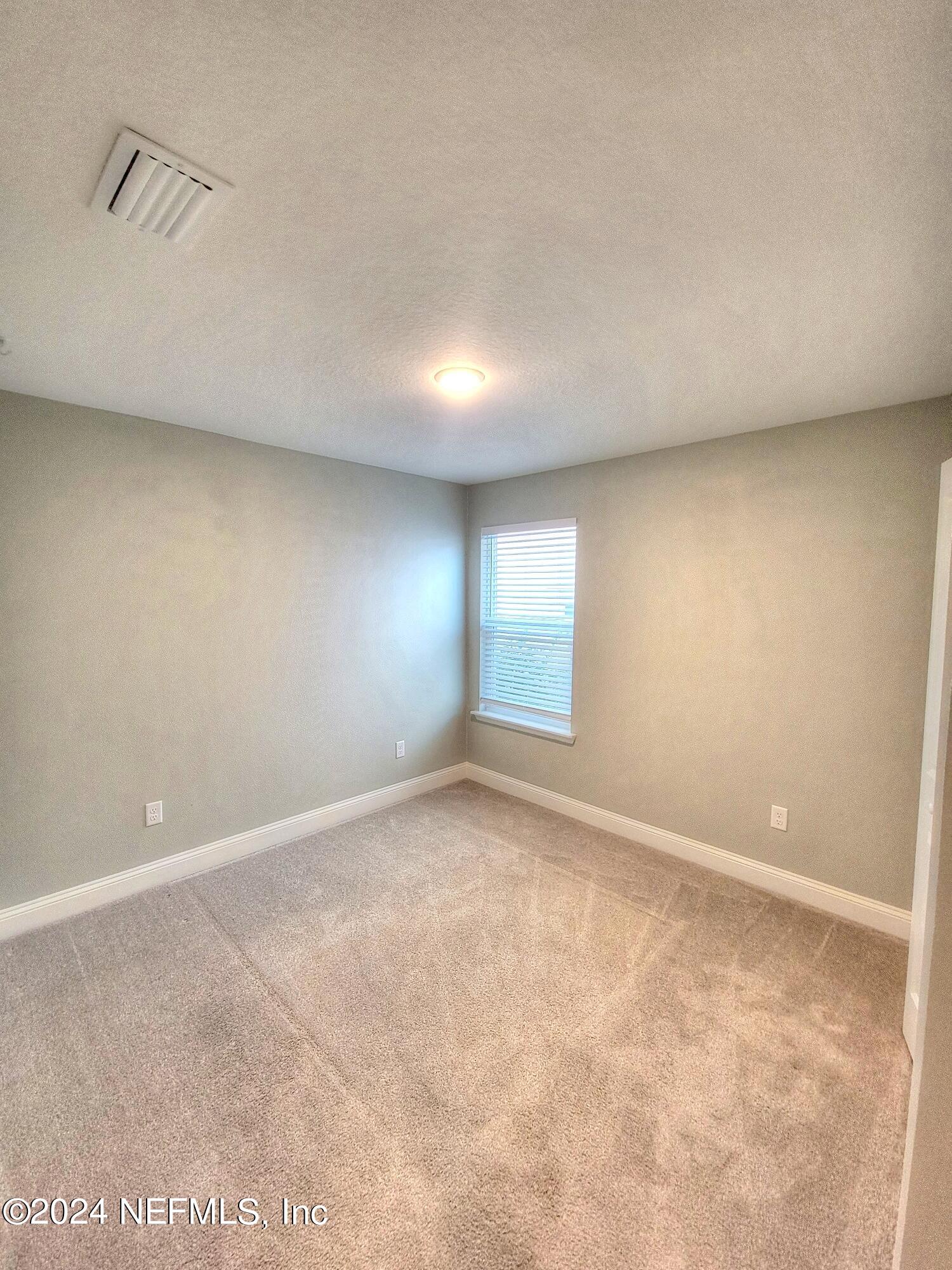 45 Vicksburg Drive St. Johns, FL 32259 - Photo 4 of 39 an empty room with windows