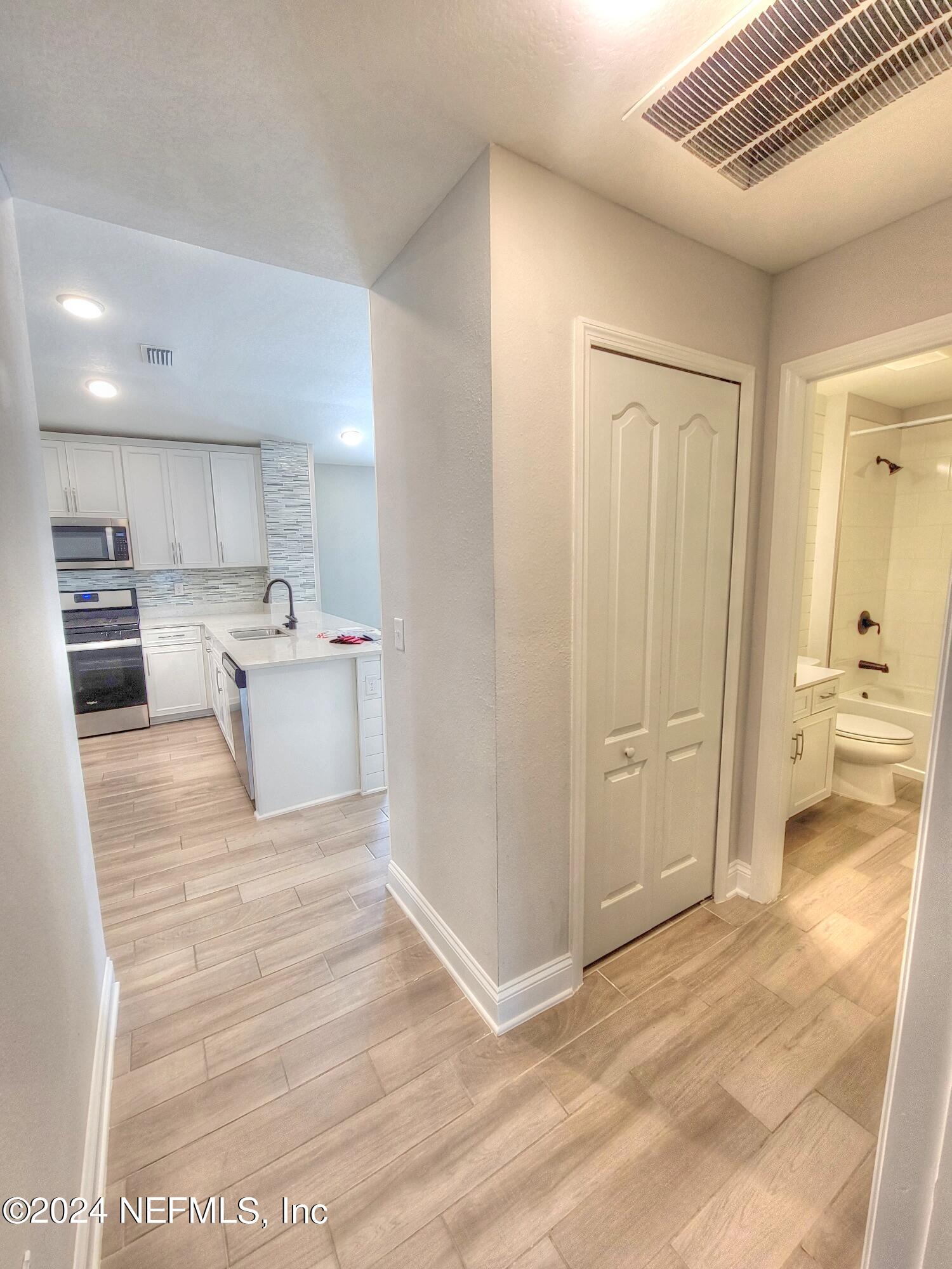 45 Vicksburg Drive St. Johns, FL 32259 - Photo 5 of 39 a view of a kitchen with kitchen island and stainless steel appliances