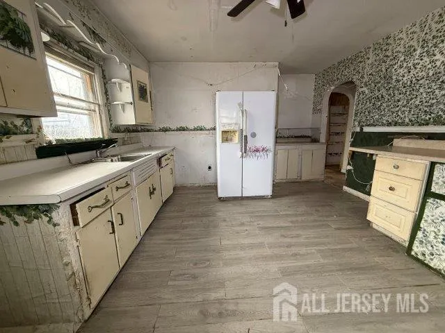 a kitchen with a stove a refrigerator and a stove
