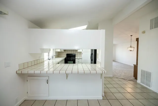 a large white bed in a white room