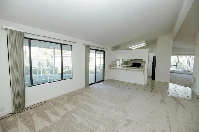 a view of livingroom with furniture and floor to ceiling window