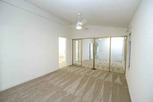 a bath room with a toilet and a bath tub