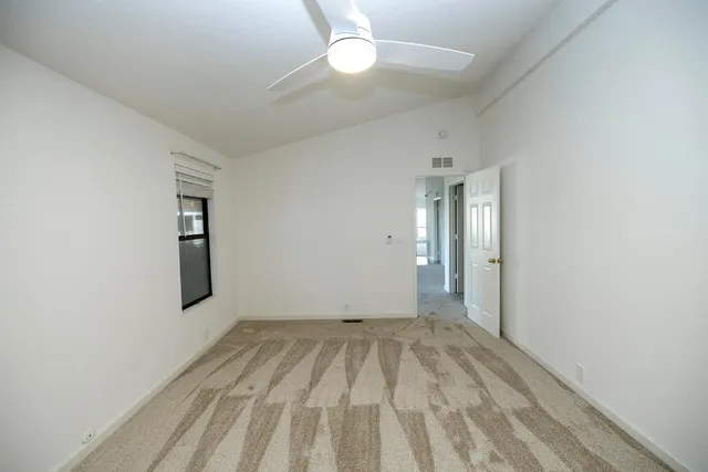 a bathroom with a tub a sink and a mirror