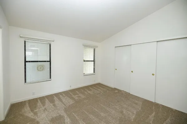 a bathroom with a shower and a glass door