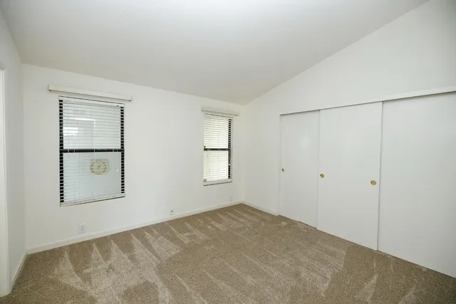 a bathroom with a shower and a glass door