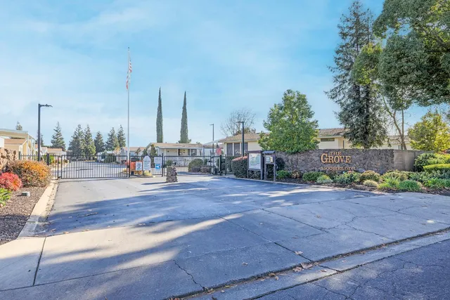 a view of car parked on the side of a street