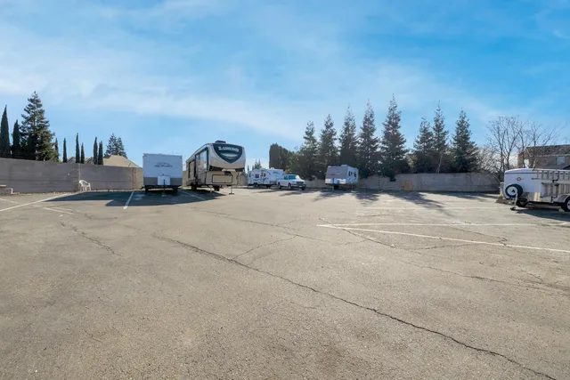 a swimming pool view with a outdoor seating