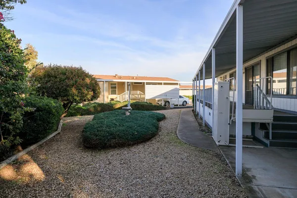 a backyard of a house with a yard fire pit and outdoor seating