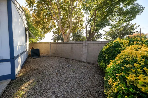 a backyard of a house with lots of green space