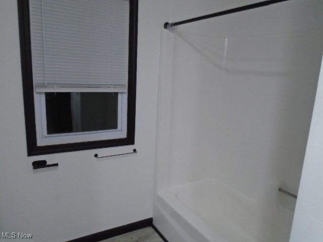 10971 Auburn Road Chardon, OH 44024 - Photo 21 of 40 Full bathroom with bathtub / shower combination and baseboards