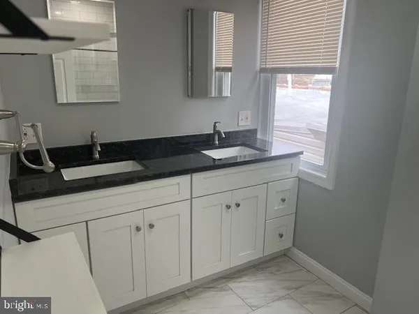 a close view of a sink and a mirror