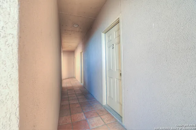 a view of a room with racks on the wall