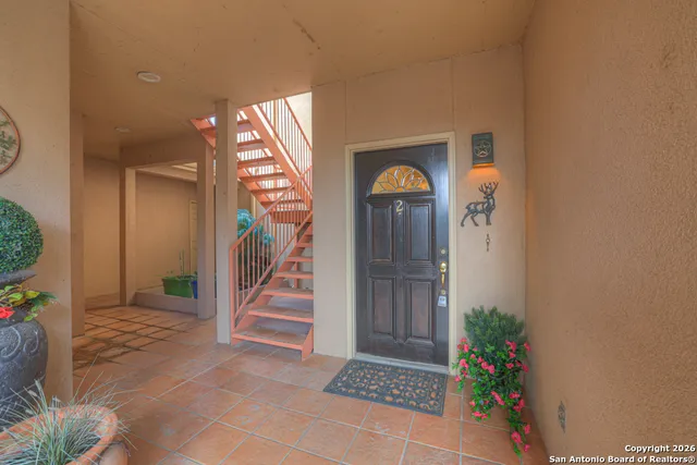 an empty room with wooden floor and a window