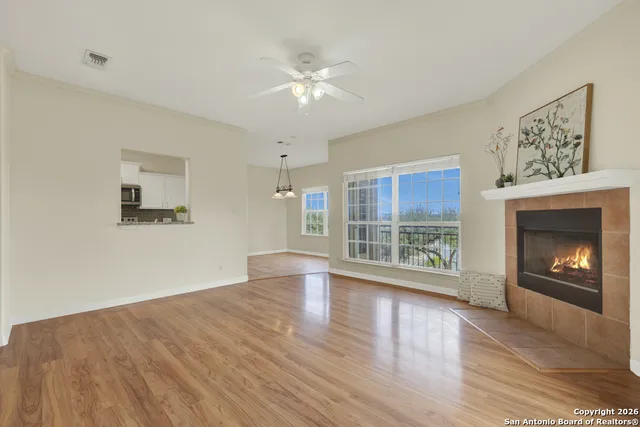 a view of a room with window and chandelier