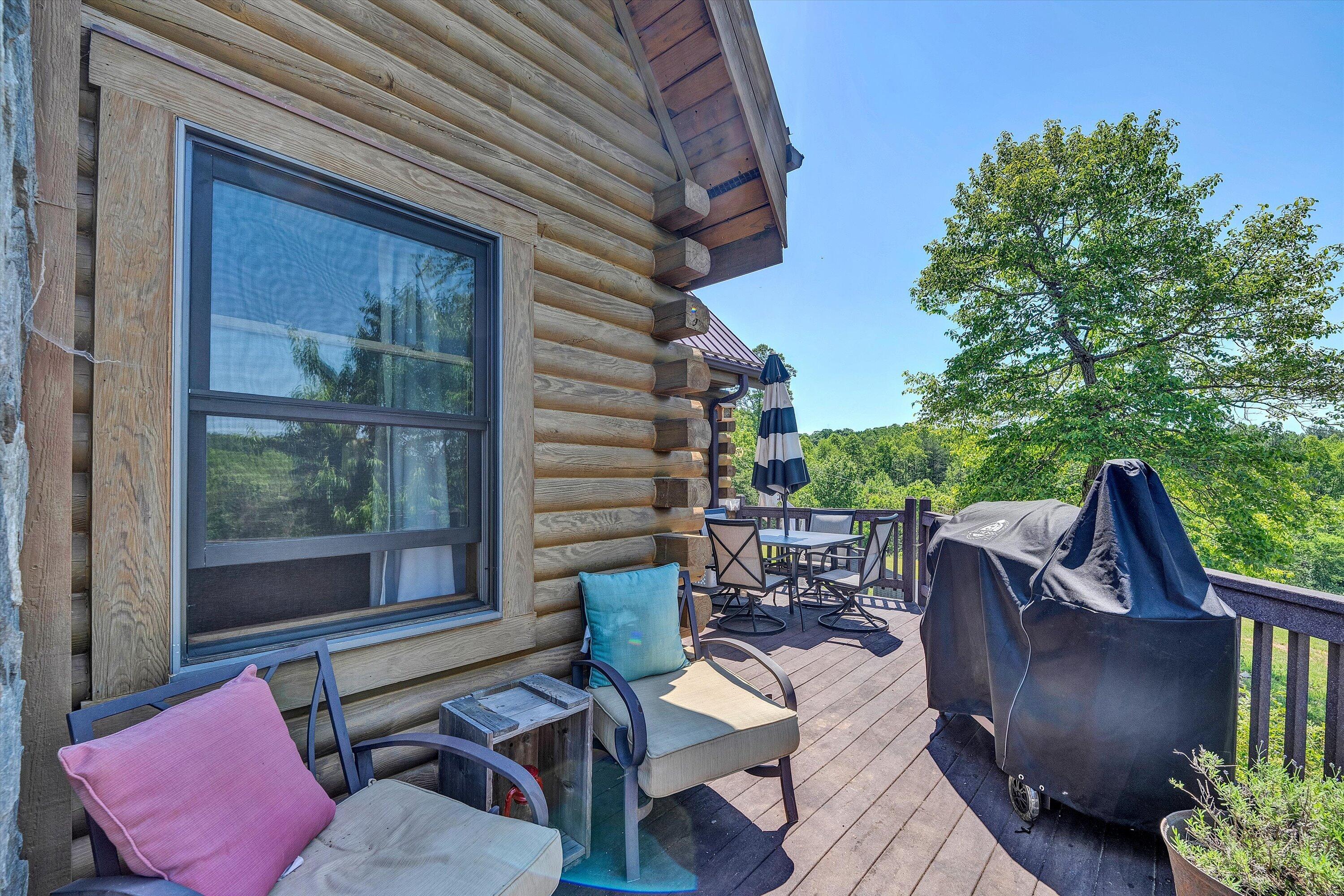180 Thompson Ridge Circle Ferrum, VA 24088 - Photo 24 of 74 a view of a porch with furniture and a yard
