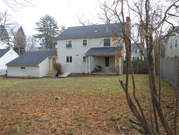 57 Buckingham Road Milton, MA 02186 - Photo 5 of 9 a view of a house with backyard and trees